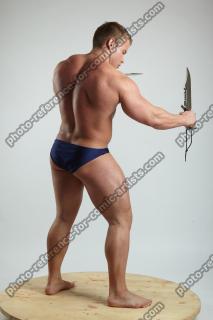 ADAM_WARD STANDING WITH TWO KNIVES